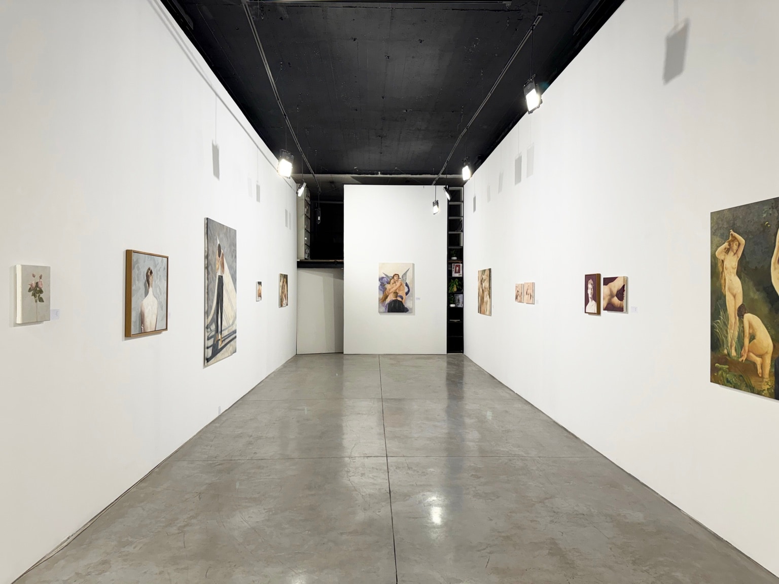 Wide installation view of Longing for Touch at Hamazrek Gallery, with paintings displayed along both gallery walls.