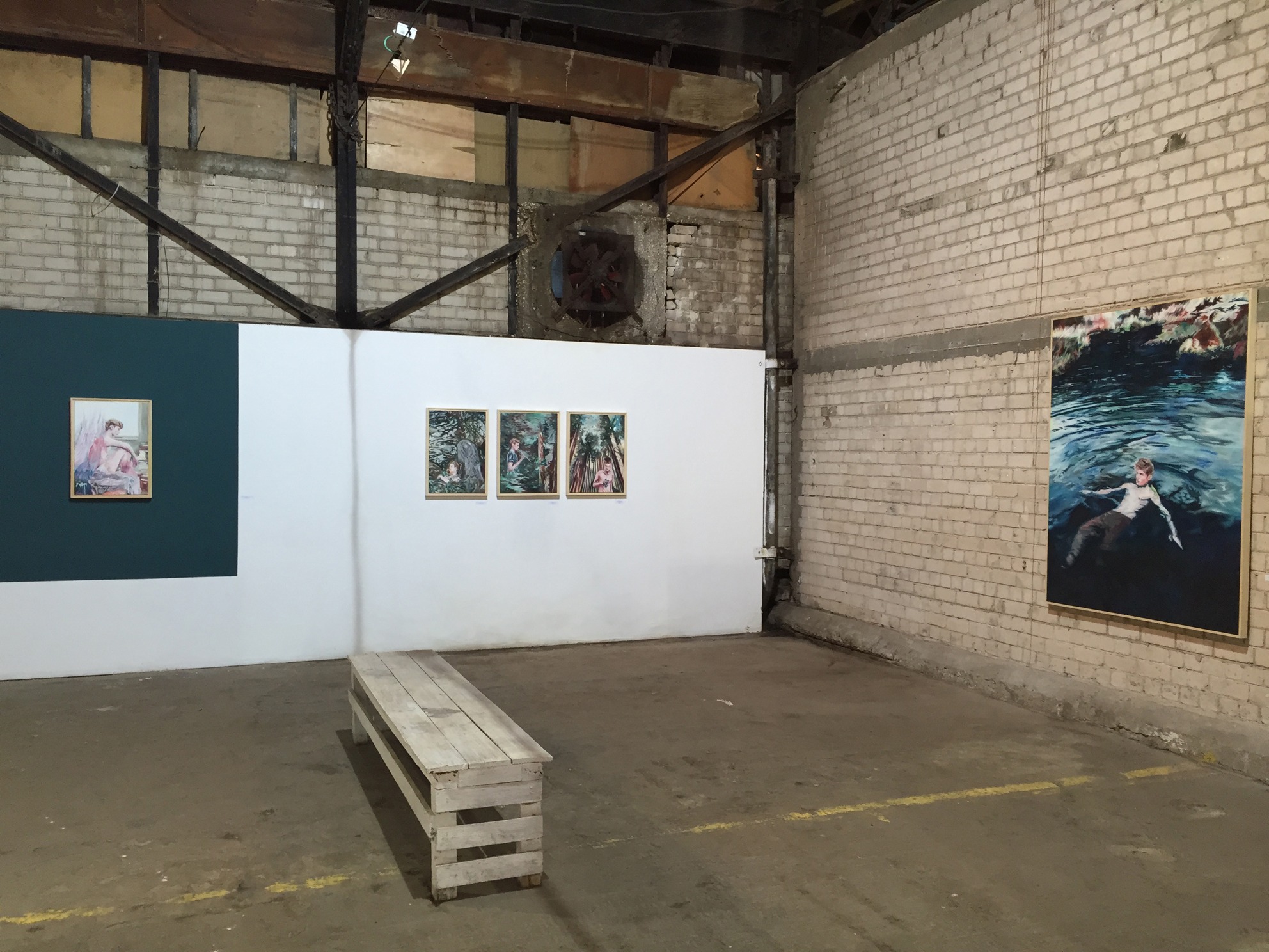 Wide installation view of We Were Here at Jaffa Art Salon, showing paintings across white and exposed-brick walls.
