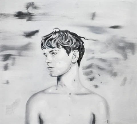 Black-and-white portrait of a bare-chested young man looking to the side.