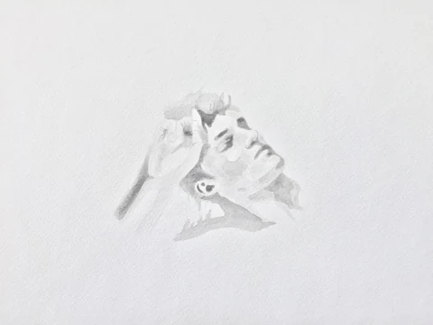 Delicate pencil study of a reclining figure on white paper.