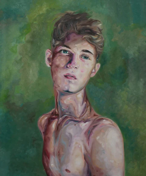 Bare-chested young man facing forward against a green background.