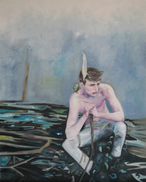 Seated bare-chested figure on a dark shoreline beside water.