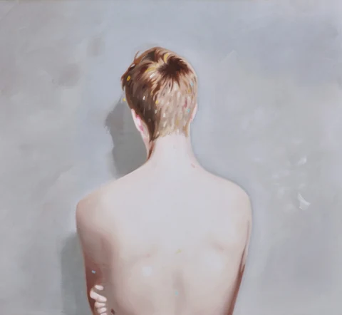 Bare-backed figure facing away against a pale gray background.