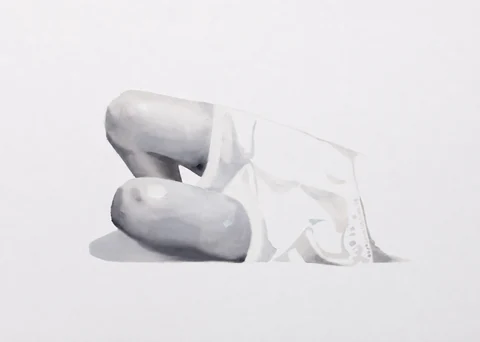 Pale reclining figure with bent legs, shown against a white background.