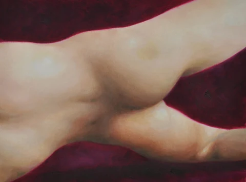 Close view of a reclining nude torso against a dark red background.
