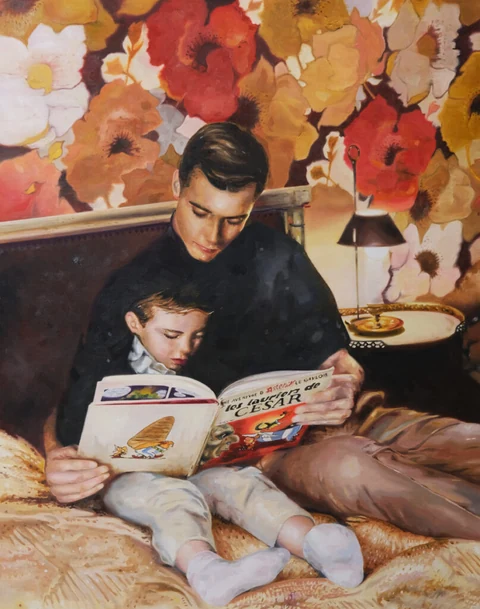 Adult and child seated together reading a picture book in a patterned interior.