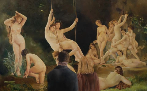Figure seen from behind facing a crowded woodland scene of nude figures.