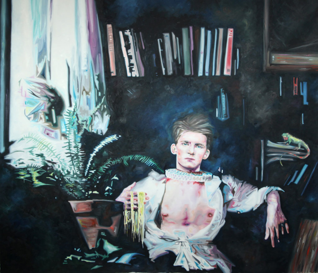 Bare-chested young man seated in a dark interior with books and plants behind him.