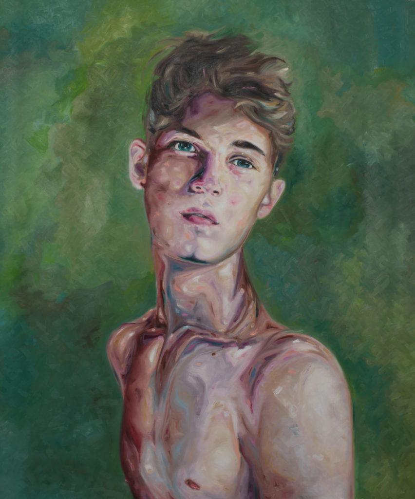 Bare-chested young man facing forward against a green background.