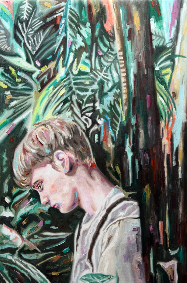Young man in profile among dense dark foliage and tree trunks.