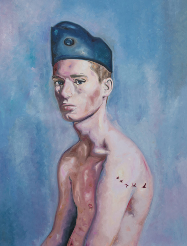 Bare-chested young man in a dark cap shown against a pale blue background.