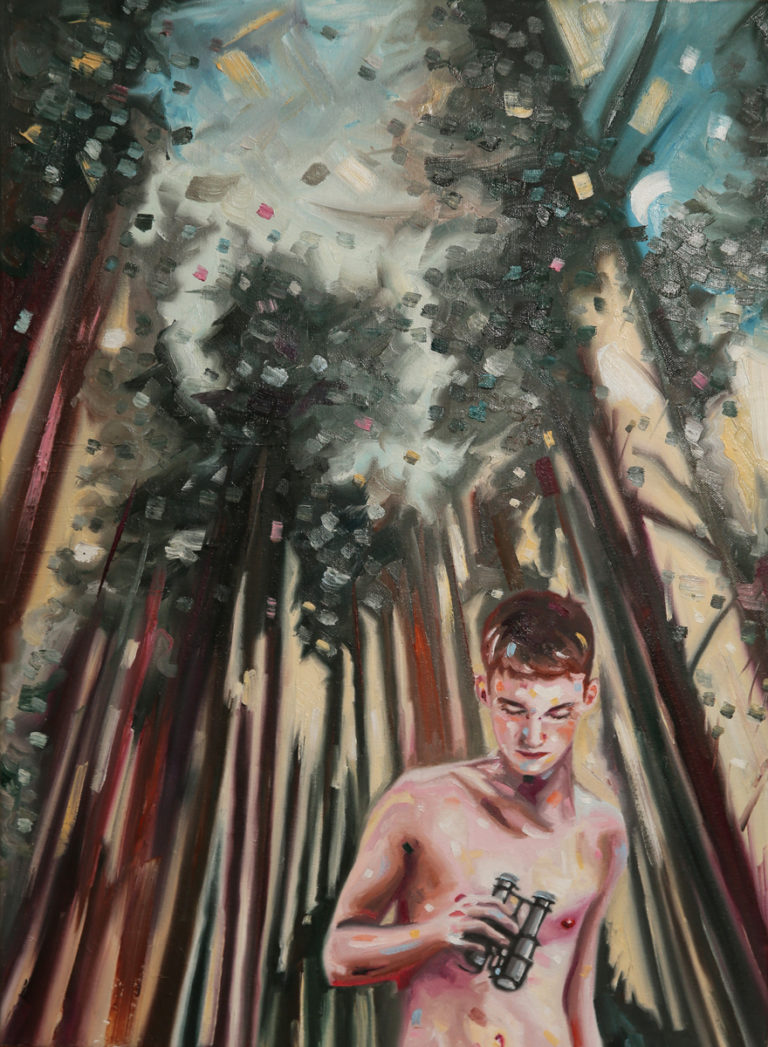 Bare-chested young man standing among tall dark trees.