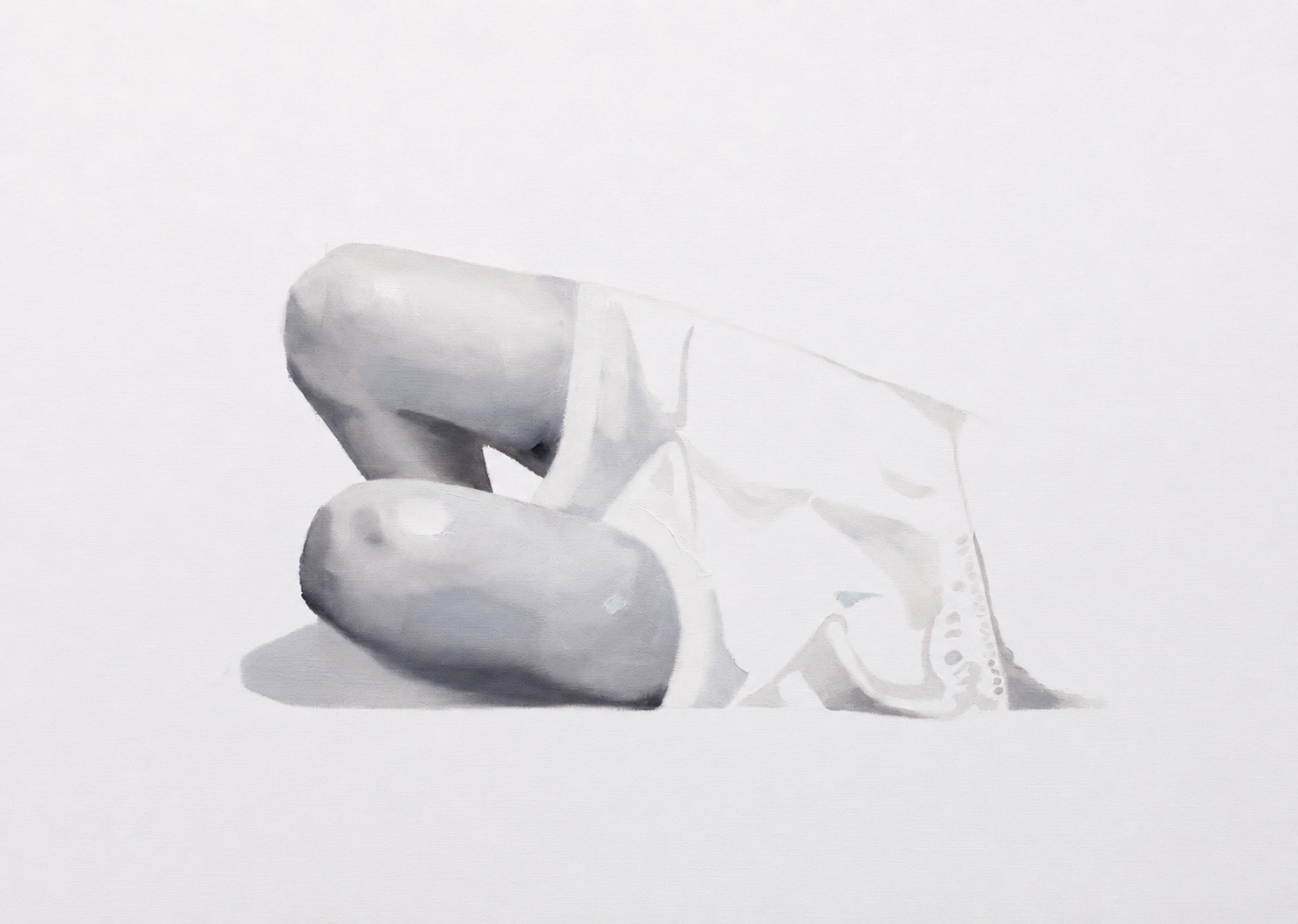 Pale reclining figure with bent legs, shown against a white background.