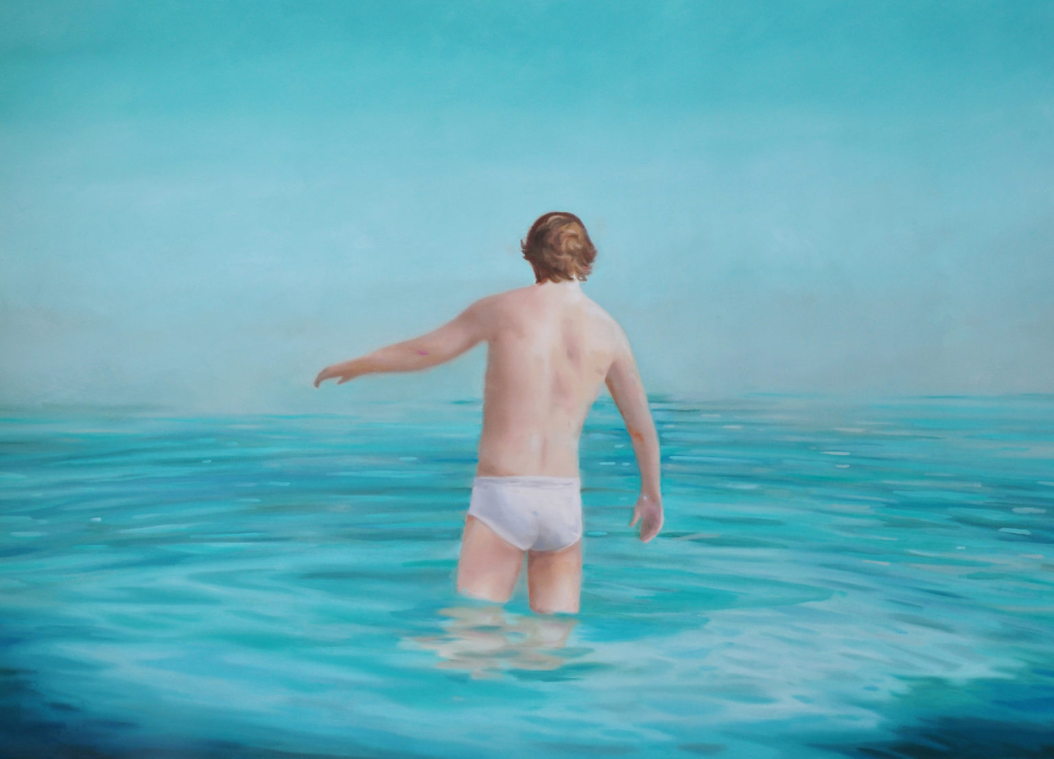 Figure walking into calm turquoise water beneath a clear sky.