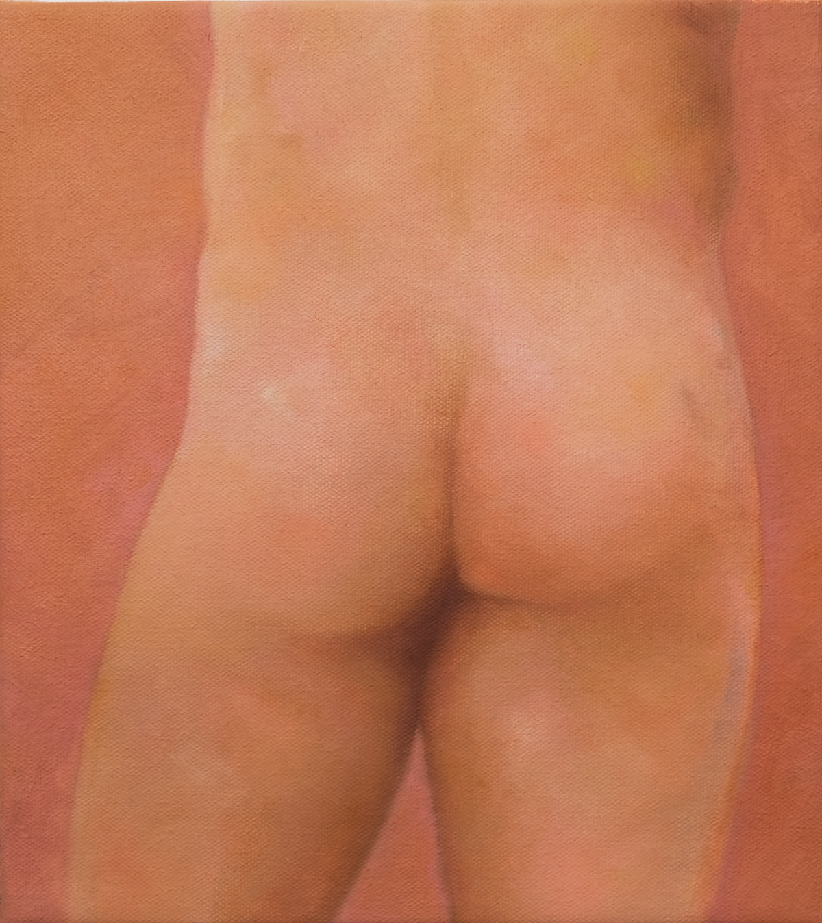 Close view of the back and hips of a nude standing figure.
